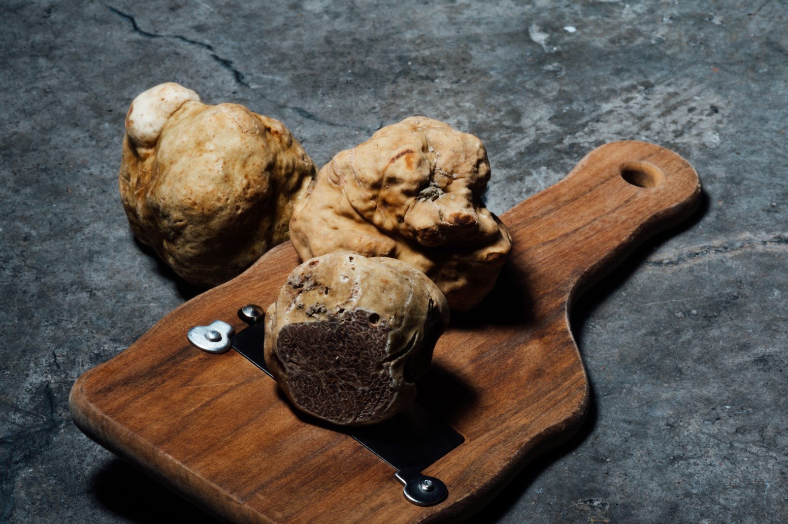 Alba white truffles on a wooden board
